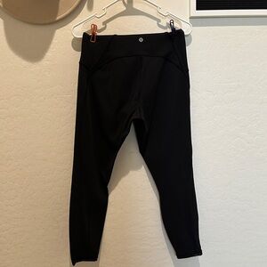Black 7/8 length lululemon leggings with mess detail